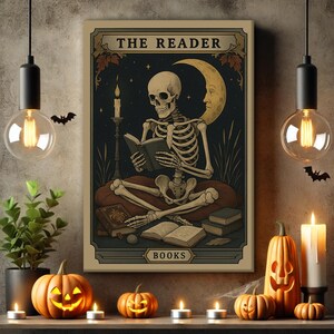 May include: A Halloween-themed artwork featuring a skeleton reading a book under a crescent moon. The artwork is titled "The Reader" and includes the word "BOOKS". The scene is decorated with pumpkins, candles, and hanging light bulbs.