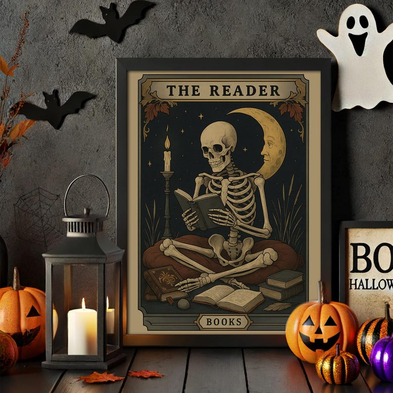 May include: A framed Halloween-themed print featuring a skeleton reading a book, titled "The Reader." The artwork has a vintage style with a dark blue night sky, a crescent moon, and a lit candle. Decorative pumpkins and bats surround the print.