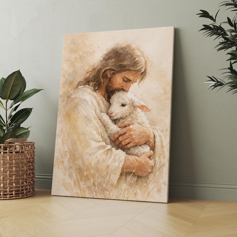 May include: A canvas print depicts a tender scene of a figure in white robes embracing a lamb. The artwork features soft, warm tones and a focus on the figures' connection. The background suggests a field with subtle details.