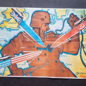 May include: A vintage propaganda poster depicting a soldier holding a heart-shaped symbol with the word "Berlin" inside. The soldier is holding three weapons, each representing a different country: a red weapon with a hammer and sickle, a blue weapon with a Union Jack, and a red, white, and blue weapon with stars. The poster is titled "A. Kokorekin. 44."