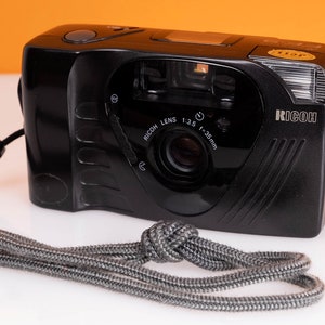 Ricoh FF9 film camera with wrist strap