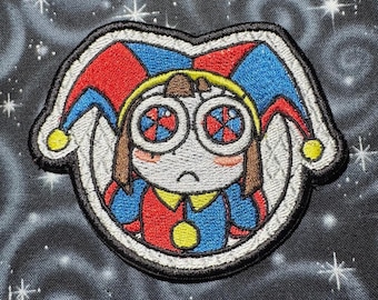 Pomni from the amazing digital circus! 3"x3.6” iron on machine embroidered patch.