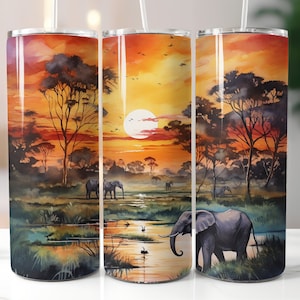 May include: Three stainless steel tumblers with a sunset scene and elephants. The tumblers have a watercolor-like design with a bright orange sunset, silhouetted trees, and elephants walking through a grassy area.