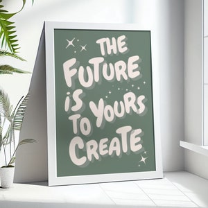 May include: A white framed print with a green background and white text that reads "The Future is Yours to Create". The text is in a stylized font with a pink outline.