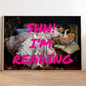 May include: A painting of a woman lying on a couch, reading a book. The text "Shh! I'm reading" is written in pink letters across the bottom of the image.