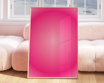 Puede incluir: Una obra de arte enmarcada de color rosa brillante con un efecto degradado, sentada en un sofá blanco en una habitación con vista a la ventana.