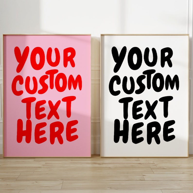 May include: Two framed prints with the text "Your Custom Text Here" in red and black on a pink and white background.