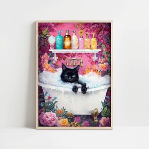 May include: A framed print featuring a black cat relaxing in a bubble bath. The cat has bright blue eyes and is surrounded by bubbles. A shelf above the tub holds various bottles, and the background is filled with flowers.