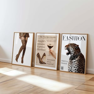 May include: Three framed art prints with a fashion theme. One features a person in leopard print thigh-high boots, another a newspaper ad for espresso martinis, and the third a leopard with the text "Wild Is a Neutral."