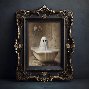 May include: A framed artwork featuring a ghost in a bathtub. The ghost is draped in a white sheet with two black eye holes. The ornate black and gold frame surrounds the image of the ghost in a vintage-style bathroom.