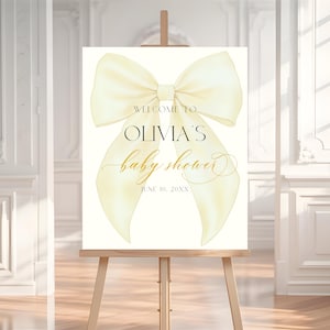 Letrero de bienvenida con lazo amarillo para baby shower, plantilla editable en Canva con diseño de coqueta amarilla, letrero de bienvenida para baby shower de primavera BS41