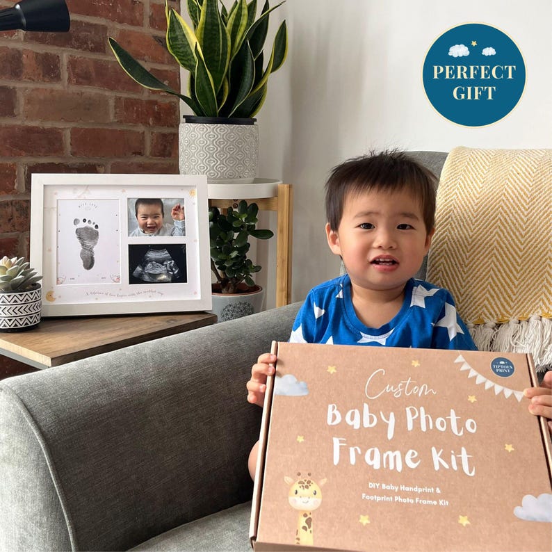 Baby handprint and footprint frame kit – a perfect baby gift and keepsake for new parents, includes space for prints and two baby photos.