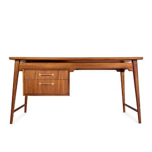 May include: A mid-century modern wooden desk with two drawers and brass hardware. The desk has a rectangular top and angled legs. The drawers are located on the left side of the desk. The desk is made of a warm-toned wood.