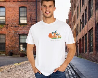 May include: White t-shirt with a graphic of orange pumpkins and the text "Pumpkin Spice Lover".