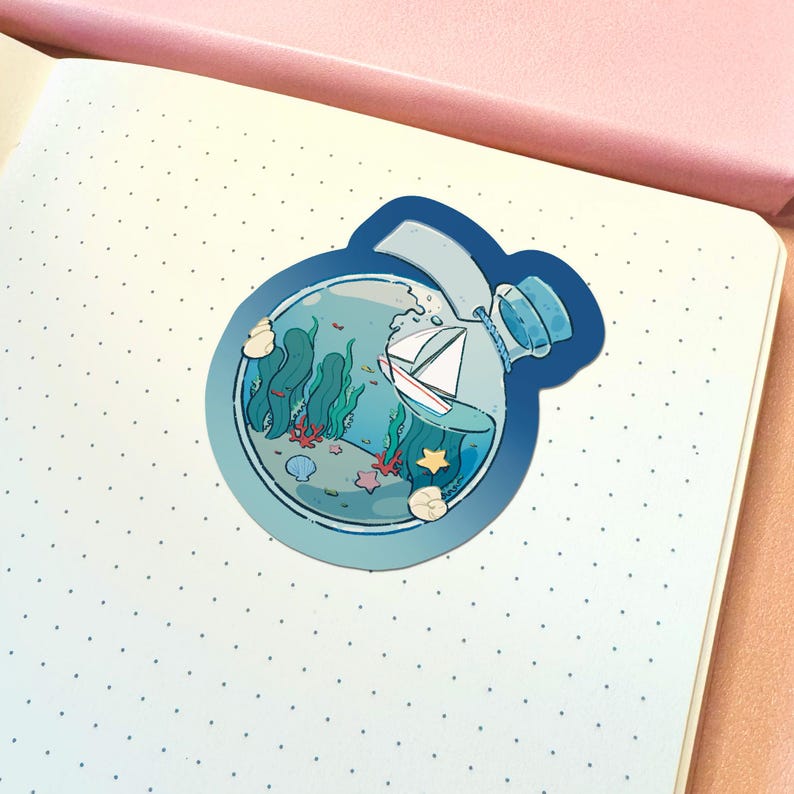 May include: A circular sticker featuring a glass bottle containing a miniature sailboat, green seaweed, and colorful seashells. The bottle is sealed with a blue cork and has a dark blue border, showcasing a detailed underwater scene with a white boat.