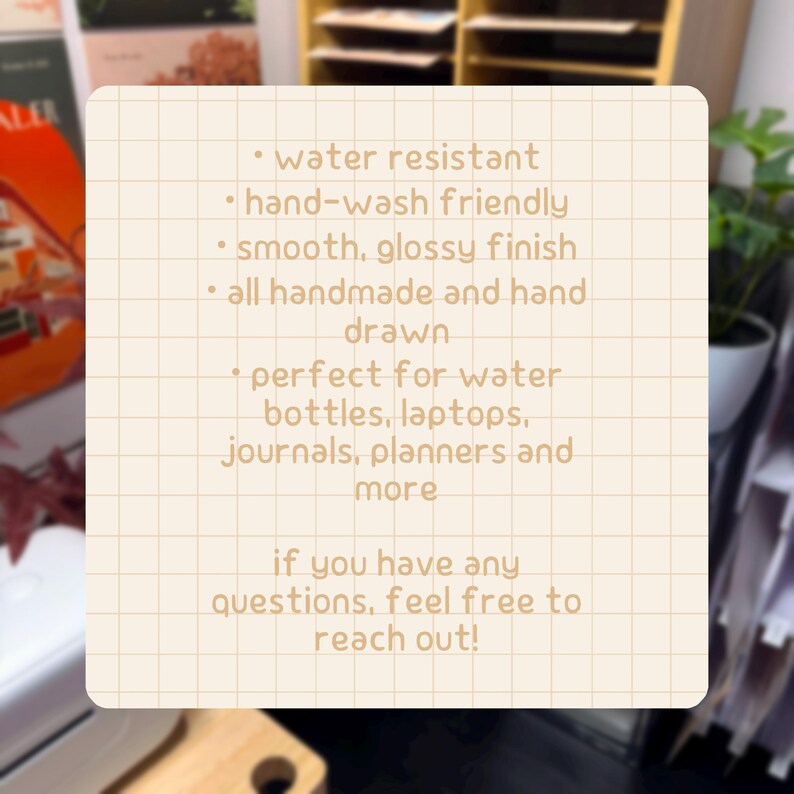 May include: A square, cream-colored informational card with a grid pattern featuring brown text: water resistant, hand-wash friendly, smooth, glossy finish, all handmade and hand drawn, for water bottles, laptops, journals, planners and more.
