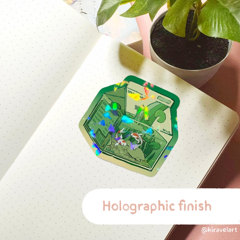 Pode incluir: Adesivo hologr&aacute;fico de um cart&atilde;o de leite verde com um design de onda e dois peixinhos dourados dentro. O adesivo tem um acabamento hologr&aacute;fico e o texto "Acabamento hologr&aacute;fico" est&aacute; impresso abaixo do adesivo.