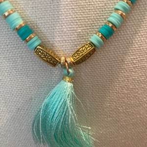 Heishi necklace in turquoise with gold accents and tassel
