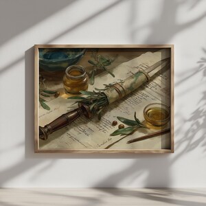 May include: A framed still life featuring a dagger with a wooden handle, olive branches, and a scroll. A small jar and bowl are also present, along with a small dish of oil and a pen. The artwork has a vintage aesthetic.