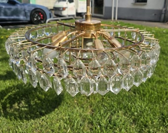 Large chandelier made of crystal glass and brass