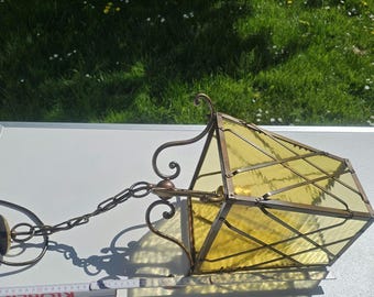 Old brass lantern light with colored glass insert