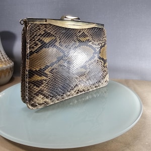 May include: A set of three ceramic mugs with a speckled, matte finish. The mugs are in shades of cream, light gray, and dark gray. Each mug has a simple, minimalist design, perfect for coffee or tea.