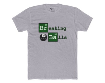 May include: A grey t-shirt with a green and black graphic design. The graphic features a black 8-ball with white stitching and the text "Breaking Balls" in a green box with the numbers 35 and 56.