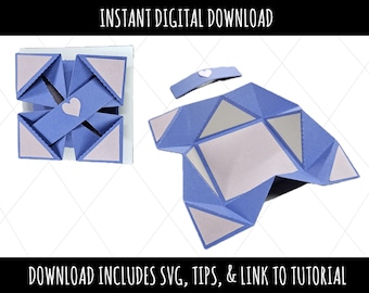 May include: A blue and white papercraft box with a heart cutout. The box is folded open to show the inside. The image text reads "INSTANT DIGITAL DOWNLOAD" and "DOWNLOAD INCLUDES SVG, TIPS, & LINK TO TUTORIAL".