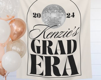 May include: A white banner with a black archway featuring a silver disco ball, the text "2024 Kenzie's GRAD ERA" and a white background.