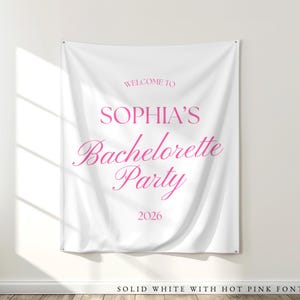 White fabric tapestry banner back drop with custom hot Pink text in an upscale trendy font, customized with the bride's name, her bachelorette party theme and additional personalized details as well as a graphic to coordiate with the theme and decorations. Perfect for a welcome sign or photo background backdrop.
