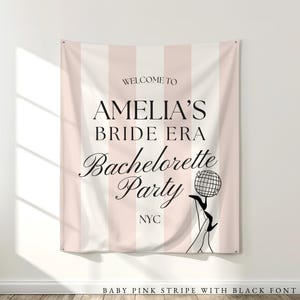 Bride Era Bachelorette Decorations: Pink and white striped fabric tapestry banner back drop with custom black text in an upscale trendy and elegant font, customized with the bride's name, her bachelorette party theme and additional personalized details as well as a graphic to coordiate with the theme and decorations. Perfect for a welcome sign or photo background backdrop.