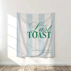 large printed light blue and green, last toast on the coast theme, fabric tapestry banner backdrop for an upscale bridal shower, bachelorette weekend, or birthday party. Choose your own solid or preppy striped background and personalize it with your own phrase printed in a trendy, minimalist and modern, old money aesthetic font.