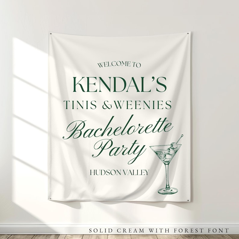 Tinis and Weenies, Martini and Hotdog Themed Bachelorette Decorations: White fabric tapestry banner back drop with custom dark green text in an upscale trendy font, customized with the bride's name, her bachelorette party theme and additional personalized details as well as a graphic to coordiate with the theme and decorations. Perfect for a welcome sign or photo background backdrop.