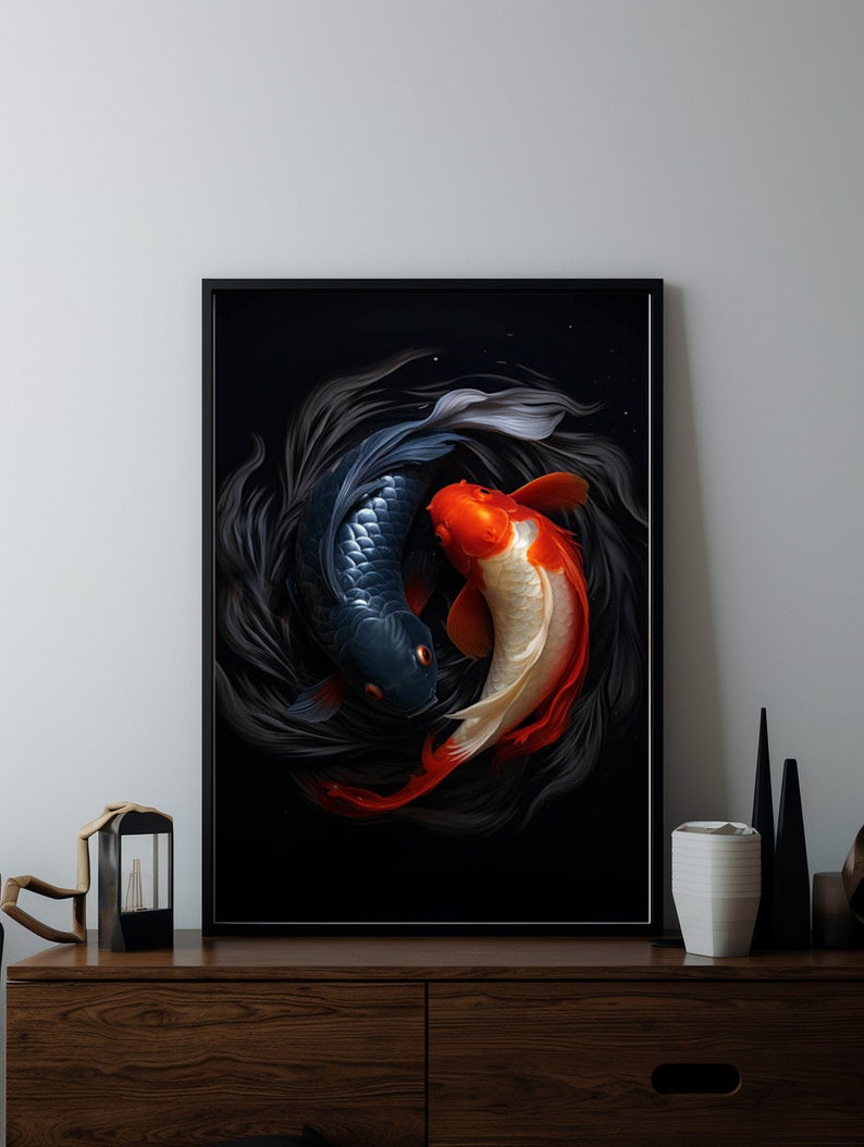 May include: A framed print of two koi fish swimming in a circle against a black background. The fish are a dark blue and a red and white colour.