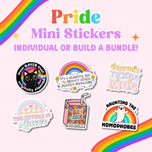 May include: A selection of Pride mini stickers featuring diverse designs and slogans. The stickers display messages such as "Much Gayer Than Originally Planned," "Support Trans Kids," and "Gay Juice." The background is pale pink with rainbow details.