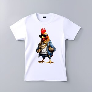 May include: White t-shirt with a graphic of a rooster wearing sunglasses, a denim jacket, and a gold chain.