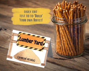 May include: A printable sign for a construction-themed party buffet. The sign is yellow and black with the text "Lumber Yard" and a picture of a pile of pretzel sticks.