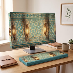 May include: A computer monitor and a matching keyboard wrist rest featuring a teal and gold geometric lattice pattern with hanging lanterns. The design displays a repeating intricate tile-like motif with warm glowing light accents.