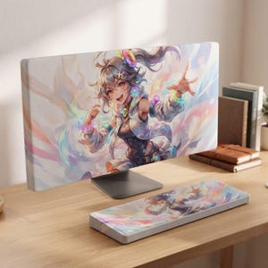 May include: A computer monitor and a matching keyboard wrist rest featuring a vibrant anime-style illustration of a character with flowing hair, wearing a white jacket and colorful accessories, set against a swirling, pastel-toned abstract background.