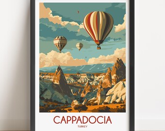 May include: A framed wall art print featuring a landscape of Cappadocia, Turkey, with three hot air balloons floating in a blue sky above rocky terrain. The text CAPPADOCIA TURKEY is printed in red at the bottom of the illustration.