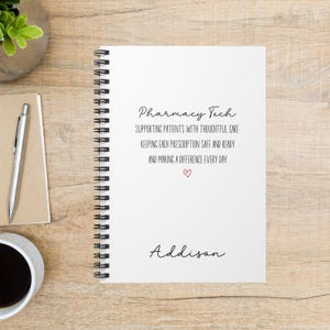 May include: A white spiral-bound notebook featuring black text that reads Pharmacy Tech, Supporting patients with thoughtful care, Keeping each prescription safe and ready, and Making a difference every day, with a small red heart and the name Addison.