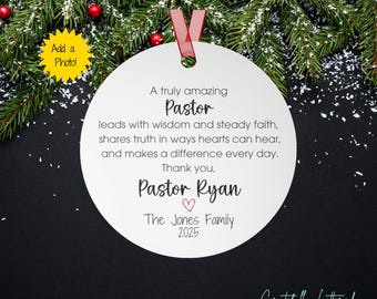May include: A round white ceramic ornament with a red ribbon, featuring black printed text: A truly amazing Pastor leads with wisdom and steady faith, shares truth in ways hearts can hear, and makes a difference every day. Thank you, Pastor Ryan, a red heart, The Jones Family, and 2025.