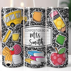 May include: A black and white tumbler with a school theme. The tumbler has a yellow school bus, a pencil, a red apple, a stack of books, a bow, and a notepad. The text on the tumbler says "Composition Book Mrs. Smith".