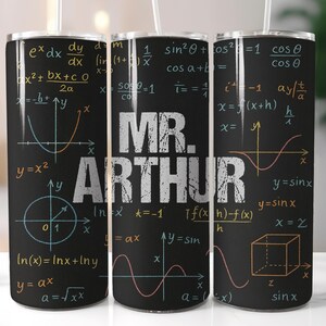 May include: A black tumbler featuring mathematical equations and graphs in white, yellow, and blue. The name "MR. ARTHUR" is prominently displayed in a distressed white font. The tumbler includes a straw.