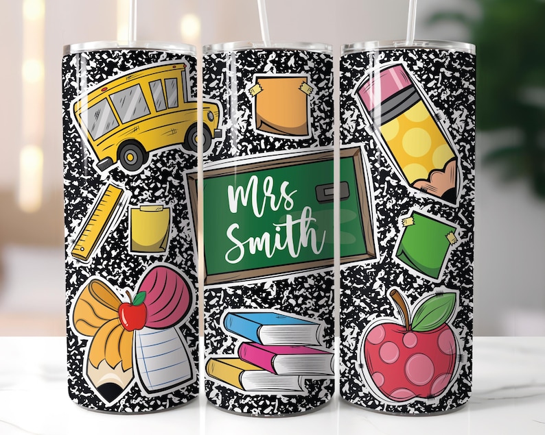 May include: A stainless steel tumbler featuring a black and white composition notebook paper design. The tumbler is decorated with school-themed stickers, including a yellow school bus, a green chalkboard with the name "Mrs. Smith", and a red apple.