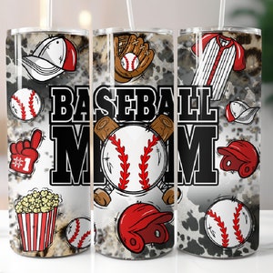 May include: A baseball-themed tumbler with a white and grey background. The tumbler features baseball graphics, including baseballs, a glove, a helmet, and the words "BASEBALL MOM" in bold black letters. A red foam finger and popcorn are also included.