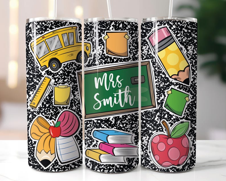 May include: A stainless steel tumbler featuring a black and white composition notebook paper design. The tumbler is decorated with school-themed stickers, including a yellow school bus, a green chalkboard with the name "Mrs. Smith", and a red apple.