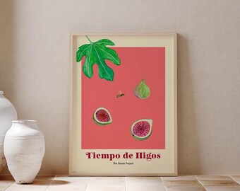 May include: A framed art print featuring a coral-pink background with a green fig leaf, one whole green fig, two halved figs showing red interiors, and a small bee. The text reads "Tiempo de Higos" and "The Siesta Project" in dark red lettering.