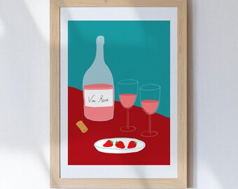 May include: A framed art print featuring a bottle of rosé wine, two wine glasses, a cork, and a plate of strawberries. The background is divided into red and teal sections, creating a vibrant contrast. The bottle label reads "Vin Rosé".