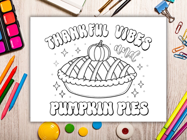 May include: A black and white coloring page featuring a pumpkin pie with the text "Thankful Vibes and Pumpkin Pies".